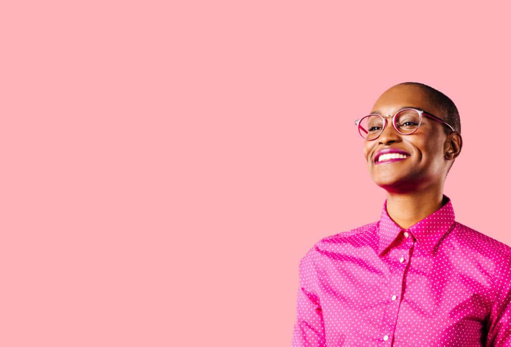 StarterStudio: Young black women over pink background.