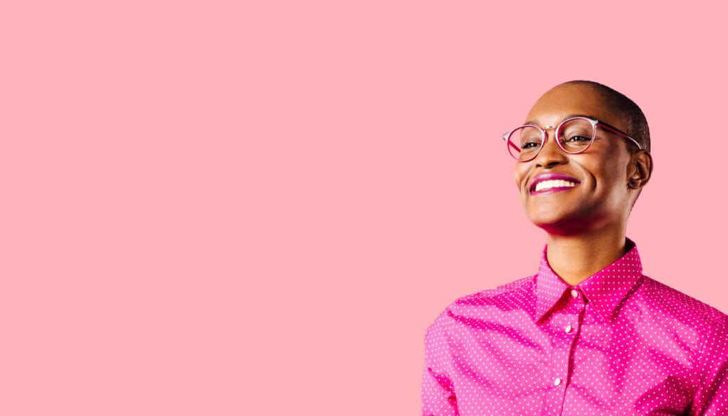 StarterStudio: Young black women over pink background.