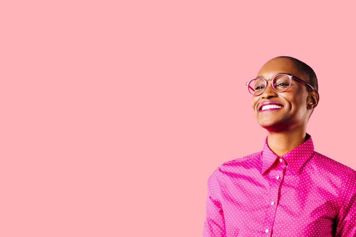 StarterStudio: Young black women over pink background.